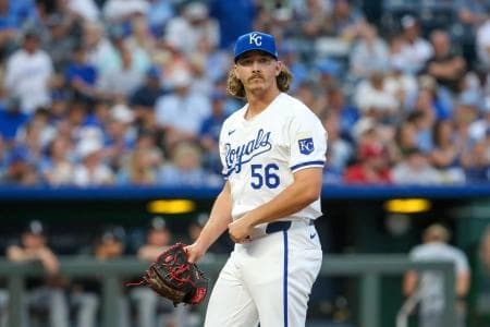Kansas City Royals relief pitcher Hunter Harvey (56) looks at the scoreboard as he comes off the field after the top of the eighth inning against the Chicago White Sox at Kauffman Stadium.