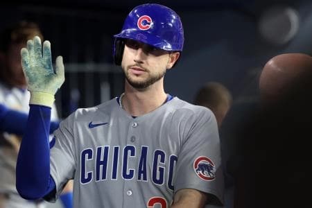 Chicago Cubs outfielder Kyle Tucker (30) reacts in the dug out after scoring a run against the Los Angeles Dodgers during the seventh inning at Dodger Stadium.