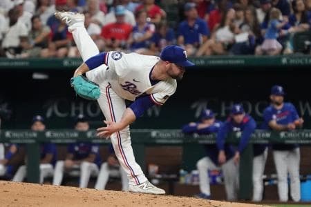 Texas Rangers pitcher Danny Coulombe (54) follows through on a pitch during the seventh inning against the Miami Marlins at Globe Life Field.