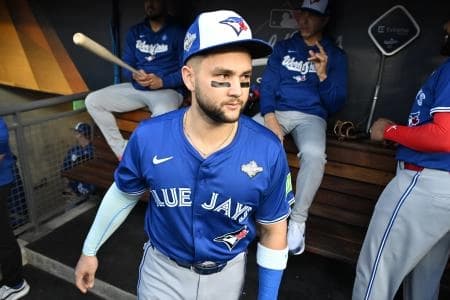 Toronto Blue Jays second baseman Bo Bichette (11) looks on before game three of the 2025 MLB World Series against the Los Angeles Dodgers at Dodger Stadium