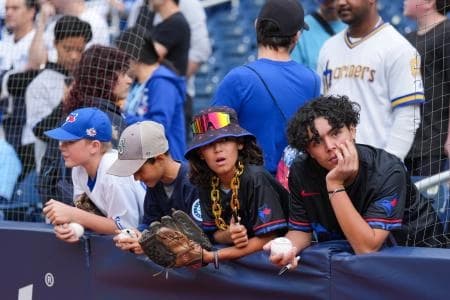 Fans watch batting practice prior to game two of the ALCS round between the Toronto Blue Jays and Seattle Mariners for the 2025 MLB playoffs at Rogers Centre.