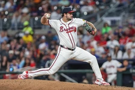Atlanta Braves pitcher Connor Seabold (61) pitches the ball against the Chicago Cubs during the eighth inning at Truist Park.
