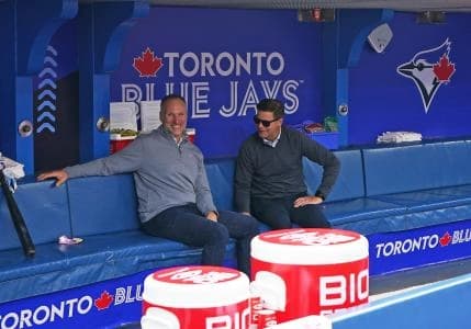 Toronto Blue Jays president Mark A. Shapiro and Toronto Blue Jays executive vice president, baseball operations general manager Ross Atkins talk while watching batting practice against the New York Yankees at Rogers Centre.