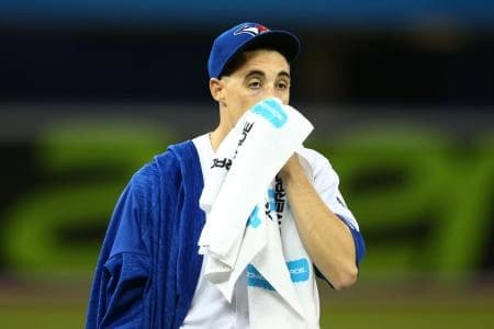 Toronto Blue Jays starting pitcher Aaron Sanchez (41) wipes the sweat of his face prior to a game against the New York Yankees at Rogers Centre.