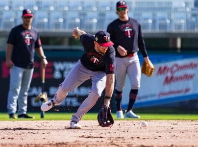 Utility player Kody Clemens fields a ground ball while warming up during the Minnesota Twins first full-squad workout of spring training at Lee Health Sports Complex in Fort Myers, Fla., on Monday, Feb. 16, 2026.