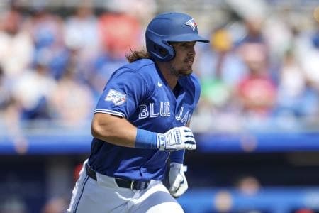 Toronto Blue Jays third baseman Addison Barger (47) hits a two-rbi single against the Detroit Tigers in the third inning during spring training at TD Ballpark.