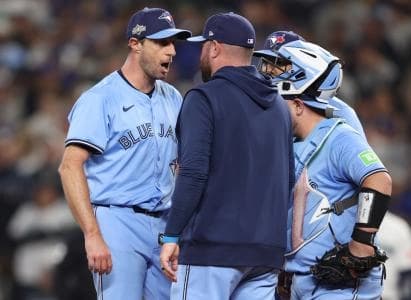 Toronto Blue Jays pitcher Max Scherzer (31) talks to manager John Schneider (14) in the fifth inning against the Seattle Mariners during game four of the ALCS round for the 2025 MLB playoffs at T-Mobile Park.