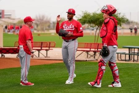 Cincinnati Reds pitching coach/director of pitching Derek Johnson (36) wraps up a bullpen session with pitcher Hunter Greene (21) at the Cincinnati Reds player development complex in Goodyear, Ariz., on Friday, Feb. 13, 2026.