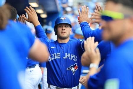Toronto Blue Jays center fielder Daulton Varsho (5) is congratulated after he hits a home run during the fifth inning against the Detroit Tigers at TD Ballpark.