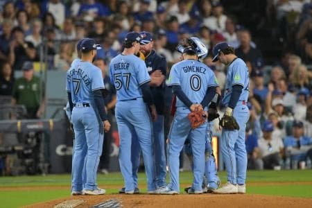 Toronto Blue Jays manager John Schneider (14) pulls Toronto Blue Jays pitcher Shane Bieber (57) from the game during the sixth inning against the Los Angeles Dodgers during game four of the 2025 MLB World Series at Dodger Stadium.