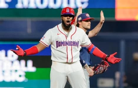 Dominican Republic first baseman Vladimir Guerrero Jr. (27) celebrates after hitting a double in the fourth inning against the United States during a semifinal game of the 2026 World Baseball Classic at loanDepot Park.