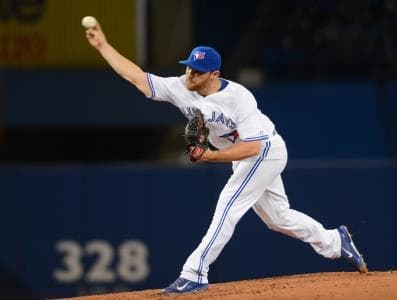 Toronto Blue Jays starting pitcher Liam Hendricks delivers pitch during the Jays 3-2 win over Oakland Athletics at Rogers Centre.