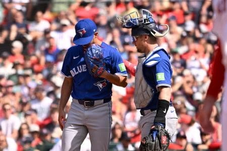 Toronto Blue Jays catcher Tyler Heineman (55) walk out to talk to relief pitcher Nick Sandlin (52) during the eighth inning against the Boston Red Sox at Fenway Park.