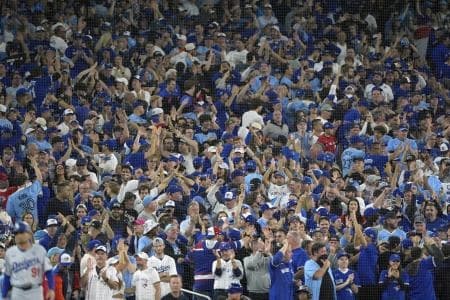 Fans cheer in the ninth inning between the Toronto Blue Jays and the Los Angeles Dodgers during game seven of the 2025 MLB World Series at Rogers Centre.