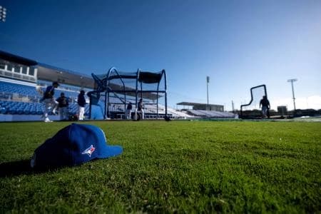 General view of a Toronto Blue Jays hat on the field during spring training at Spectrum Field.