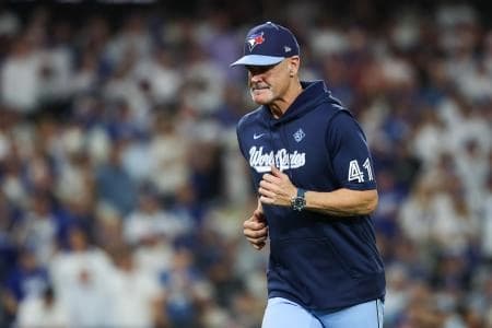 Toronto Blue Jays pitching coach Pete Walker (41) jogs off the field during the eighth inning against the Los Angeles Dodgers during game five of the 2025 MLB World Series at Dodger Stadium.