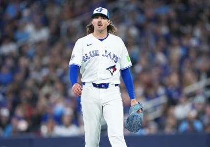 Toronto Blue Jays starting pitcher Kevin Gausman (34) walks towards the dugout against the Athletics during the fourth inning at Rogers Centre.