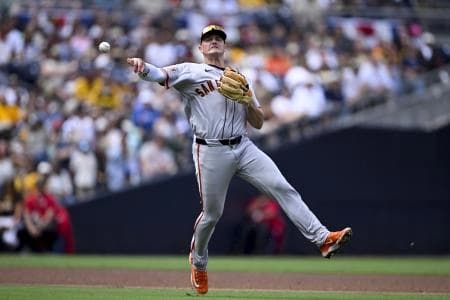San Francisco Giants third baseman Matt Chapman (26) throws to first base but can’t get the out on San Diego Padres shortstop Xander Bogaerts (2) during the fifth inning at Petco Park.