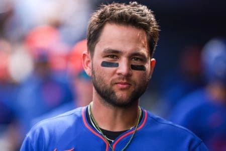 New York Mets third baseman Bo Bichette (19) looks on from the dugout against the Washington Nationals during the third inning at CACTI Park of the Palm Beaches.