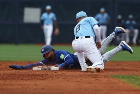 Toronto Blue Jays outfielder Steward Berroa (37) slides safe into second base as Tampa Bay Rays second base Brandon Lowe (8) attempted to tag him out during the second inning at Charlotte Sports Park.
