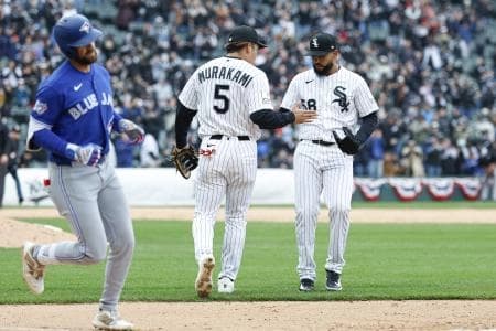 Chicago White Sox first baseman Munetaka Murakami (5) celebrates with relief pitcher Seranthony Dominguez (58) teams win against the Toronto Blue Jays in a baseball game at Rate Field.