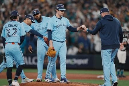 Toronto Blue Jays manager John Schneider (14) takes the ball from pitcher Brendon Little (54) in the eighth inning during game five of the ALCS round against the Seattle Mariners for the 2025 MLB playoffs at T-Mobile Park.