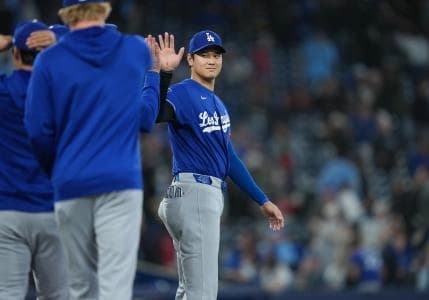 Los Angeles Dodgers designated hitter Shohei Ohtani (17) celebrates the win against the Toronto Blue Jays at the end of the ninth inning at Rogers Centre.