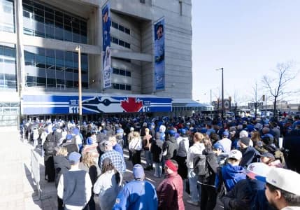 Fans wait in line before the Opening Day game between the Athletics and Toronto Blue Jays at Rogers Centre.