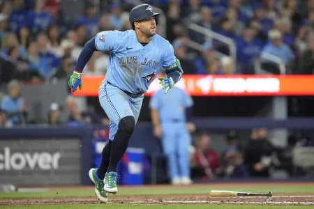 Toronto Blue Jays designated hitter George Springer (4) hits a one run double against the Los Angeles Dodgers during the seventh inning at Rogers Centre.