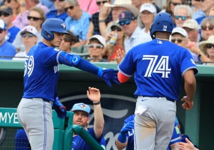 Toronto Blue Jays designated hitter Eloy Jimenez (74) scores a run by Toronto Blue Jays catcher Brandon Valenzuela (59) sacrifice hit at JetBlue Park at Fenway South.