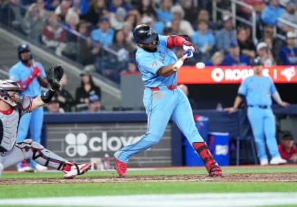 Toronto Blue Jays first baseman Vladimir Guerrero Jr. (27) hits a single against the Minnesota Twins during the ninth inning at Rogers Centre.