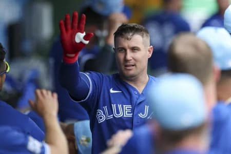 Toronto Blue Jays catcher Tyler Heineman (55) races after hitting a home run against the Philadelphia Phillies in the first inning during spring training at BayCare Ballpark.