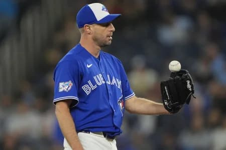 Toronto Blue Jays starting pitcher Max Scherzer (31) flips a ball out of his glove before throwing a pitch to the Minnesota Twins during the second inning at Rogers Centre.