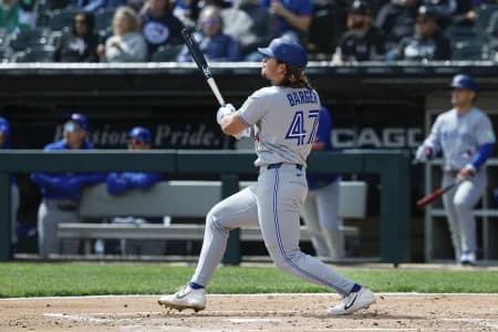 Toronto Blue Jays right fielder Addison Barger (47) hits a double against the Chicago White Sox during the second inning at Rate Field.