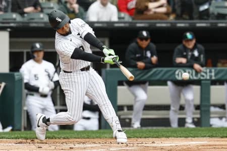Chicago White Sox designated hitter Lenyn Sosa (50) hits a single against the Toronto Blue Jays during the first inning at Rate Field.