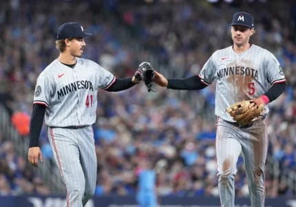 Minnesota Twins starting starting pitcher Joe Ryan (41) celebrates the final out with third baseman Ryan Kreidler (5) against the Toronto Blue Jays during he seventh inning at Rogers Centre.