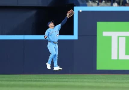 Toronto Blue Jays center fielder Daulton Varsho (5) is unable to catch a fly ball against the Minnesota Twins during the third inning at Rogers Centre.