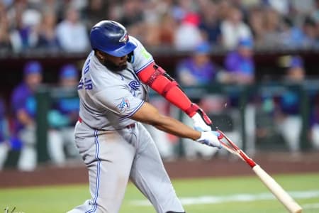 Toronto Blue Jays first baseman Vladimir Guerrero Jr. (27) hits a broken bat RBI single during the eighth inning at Chase Field.