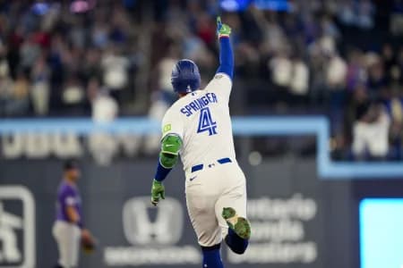 Toronto Blue Jays George Springer (4) celebrates hitting a home run against the Colorado Rockies during the third inning at Rogers Centre.
