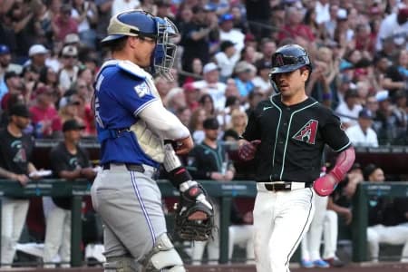 Arizona Diamondbacks right fielder Corbin Carroll (7) scores a run against the Toronto Blue Jays in the first inning at Chase Field.