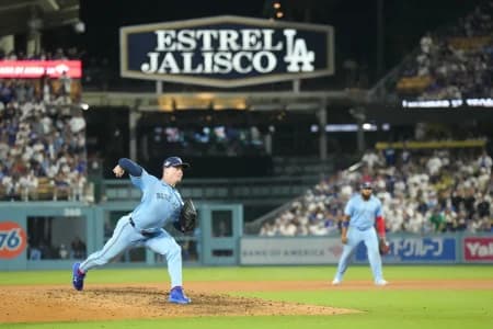 Toronto Blue Jays pitcher Louis Varland (77) pitches during the ninth inning against the Los Angeles Dodgers during game four of the 2025 MLB World Series at Dodger Stadium
