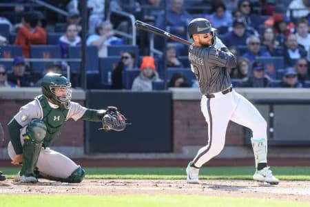 New York Mets third baseman Bo Bichette (19) hits an RBI single in the first inning against the Athletics at Citi Field.