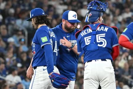 Toronto Blue Jays manager John Schneider (14) relieves starting pitcher Dylan Cease in the sixth inning against the Boston Red Sox at Rogers Centre.