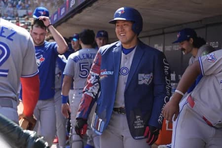Toronto Blue Jays third baseman Kazuma Okamoto (7) celebrates his solo home run against the Minnesota Twins in the sixth inning at Target Field.