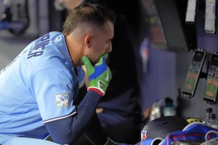 Toronto Blue Jays designated hitter George Springer (4) reviews video during the seventh inning against the Boston Red Sox at Rogers Centre.