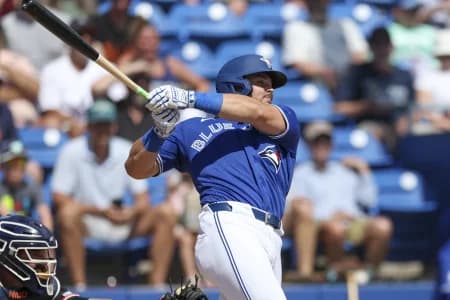 Toronto Blue Jays third baseman Addison Barger (47) hits a two-rbi single against the Detroit Tigers in the third inning during spring training at TD Ballpark.