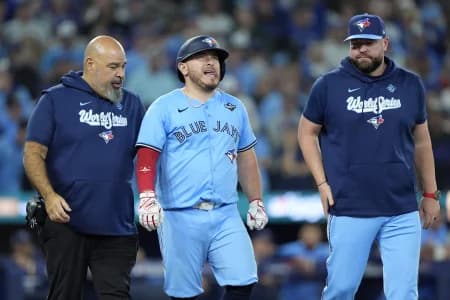 Toronto Blue Jays catcher Alejandro Kirk (30) walks to first after being hit by a pitch against the Los Angeles Dodgers in the ninth during game six of the 2025 MLB World Series at Rogers Centre.