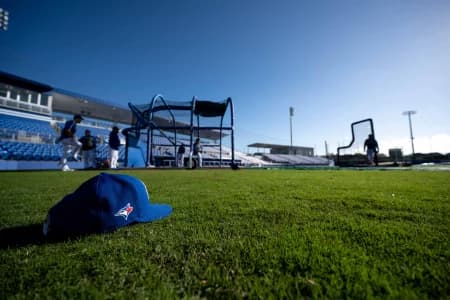 General view of a Toronto Blue Jays hat on the field during spring training at Spectrum Field.