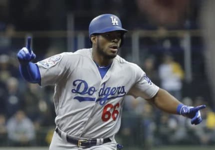 Los Angeles Dodgers outfielder Yasiel Puig (66) celebrates after hitting a three-run home run against the Milwaukee Brewers in the sixth inning in game seven of the 2018 NLCS playoff baseball series at Miller Park.