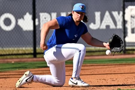 Toronto Blue Jays outfielder Addison Barger (47) fields a ground ball during spring training at Bobby Mattick Training Center at Englebert Complex.